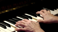 hands playing piano